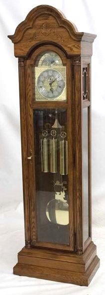2094 - Howard Miller oak grandfather clock Westminister chime sun & moon dial face 77 x 18 1/2 x 14
