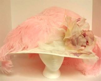 Pretty, pretty pink feathered hat.