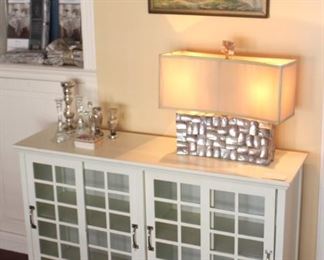 Lovely glass paneled cabinet shown with abalone lamp and R. Atkinson print.