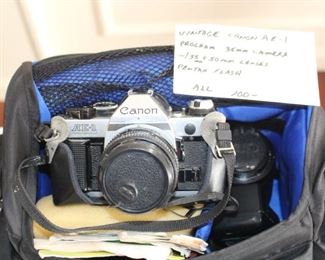 Canon AE-1 camera with lenses.