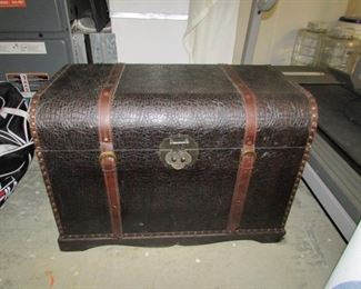 trunk with leather straps