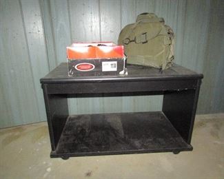 TV stand and military shoes and gas mask