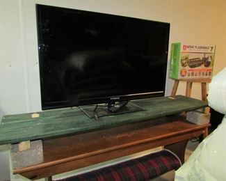 TV and wooden bench
