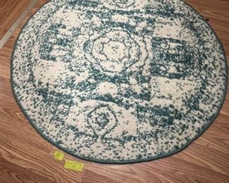 Teal and cream round area rug