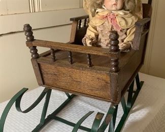 Vernon Seeley Porcelain Doll in wooden doll sled