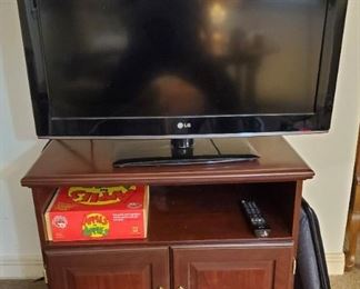LG TV, stand, game and TV trays