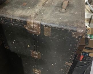 Old steamer trunk as well as other antique trunks
