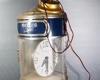 Anheuser Busch Michelob Light Hanging Clock, Clock Rotates Inside Case, Approx 24" H x 10.5" Dia, Powers On