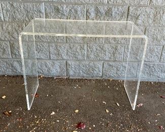 Lot #12 in the Town & Sea Fall Multi-Seller Sale is a Luctie Waterfall Console Table and is 38"w x 15"d x 29"h The condition of these  is Has light scratches, see photos. The auction closes 11/30 at 8pm. Place your bids today! https://townandsea.com/sales/fall-multi-seller-sale/