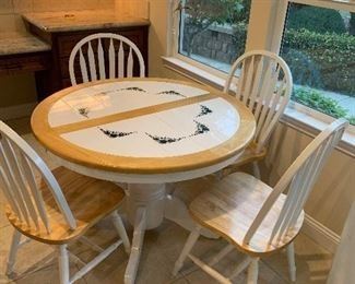 round tile top table with 4 chairs