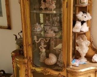 Unique large antique curio cabinet. Shelves on outsides and glass enclosed shelves on inside. Elegant piece to show off your treasures. 