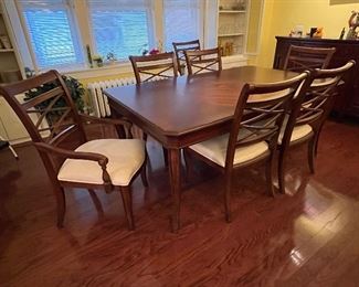 Dining room table with 2 leaves (not shown), 2 captains chairs and 6 side chairs!