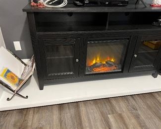 Entertainment table with built in fireplace