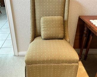 There are a pair of customer upholstered parsons chairs