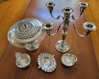 Sterling silver (insert in large bowl/flower arranger is silverplate)