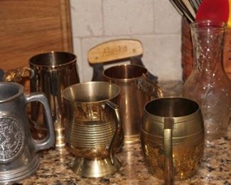 Pewter and brass mugs