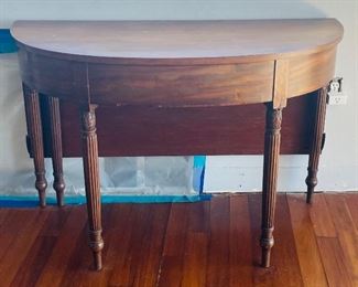 38______$800 
Pair of Demi lune tables making a dining table (one leg need  repairs)
Dining Table 45Wx82Lx29H becomes 2 half moon table 21"D  x45W