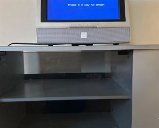 15in Trutech Thin LCD TV and Gray Metal and Glass Entertainment Center on Casters