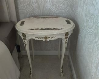 white antique table with gold trim