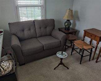 gray colored couch and end tables