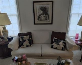white couch, deco pillows, deco art