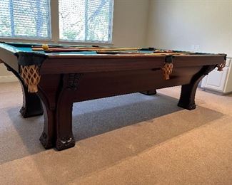 Art Nouveau billiard pool table, ca. 1904 by Brunswick, Balke & Collender Company; oak, mahogany and rosewood, with double elephant feet on elephant legs. Excellent condition, completely and professionally restored.