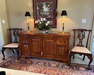 Tommy Bahama buffet with horizontal wine storage behind center doors.  Two of the eight Drexel chairs stands by.  Print on wall is of Callaway Gardens.