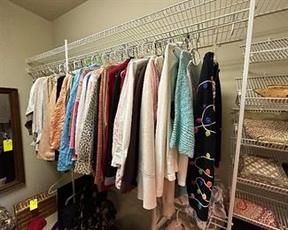 Closet full of women's clothing.  Some are antiques.