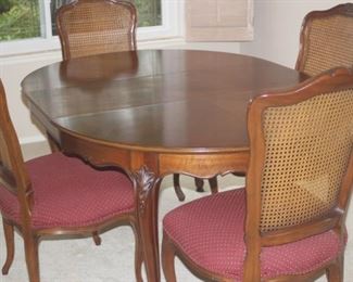 Dining table with 6 chairs, leaves and pads.