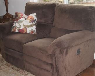 Dual reclining love seat and matching dual reclining sofa.