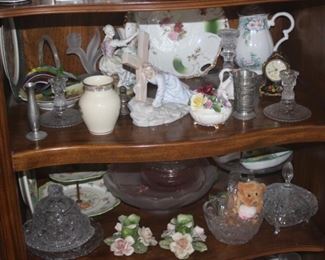 Shelves filled with crystal, bone china, figurines.