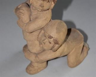 Carved clay vintage football players. By Lee Bonim