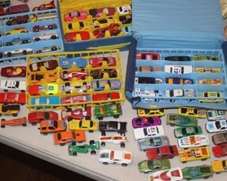 Hot Wheels and Dinky Toys with  carrying cases.