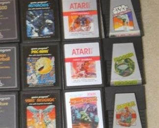 Vintage Atari 2600 Console and Joy Sticks and Controllers with many game cartridges.