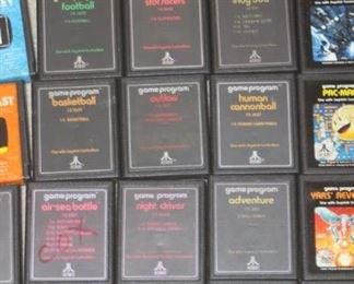 Vintage Atari 2600 Console and Joy Sticks and Controllers with many game cartridges.