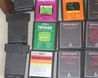 Vintage Atari 2600 Console and Joy Sticks and Controllers with many game cartridges.