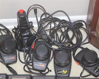 Vintage Atari 2600 Console and Joy Sticks and Controllers with many game cartridges.