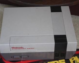 Classic Nintendo Entertainment System with controllers and games. 