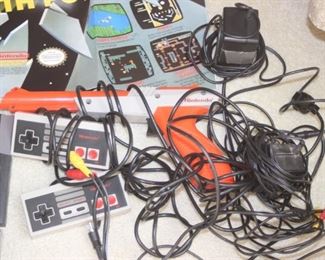 Classic Nintendo Entertainment System with controllers and games. 