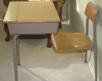 Vintage school room desk with attached chair.