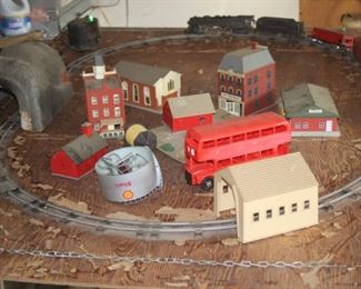 Train track, trains, scenery and power transformer.