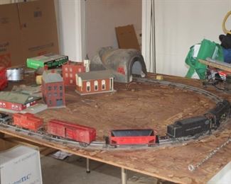 Train track, trains, scenery and power transformer.