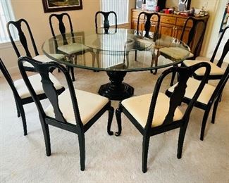 11_____$600 
80"wide round glass wood pedestal table with 8 black 
lacquer chairs made in Italy 