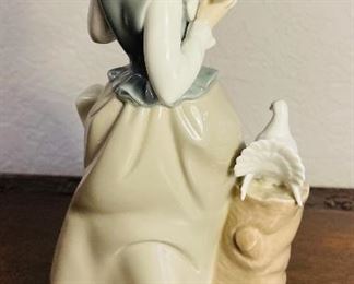 36_____$50 
Lladro girl with 2 doves - 4915 retired - 8 1/2"