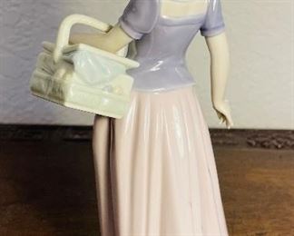 37_____$50 
Lladro little girl with basket 1997 - 6489 - 7 1/2"