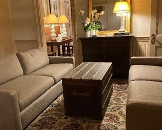 Pair of pristine matching Century sofas, antique palace size rug