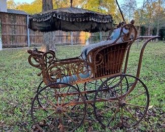 Antique, authentic Victorian baby carriage, complete with original fabric 