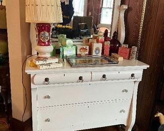 Antique white painted dresser with tilting mirror. Glass drawer pulls.