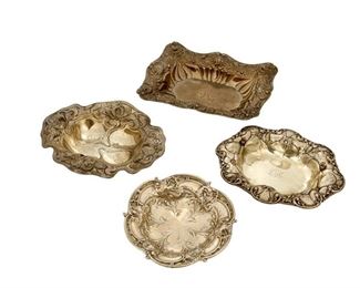 4004
A Group Sterling Silver Holloware Trays
Late 19th/early 20th century
Each marked for sterling, with various maker's marks
Each tray with Art Nouveau floral designs, 4 pieces
Largest: 1.375" H x 7.75" W x 6.25" D
17.005 oz. troy approximately
Estimate: $400 - $600