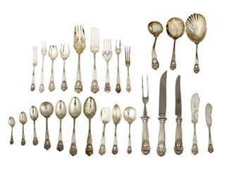 4006
A Towle "Georgian" Sterling Silver Flatware Service
20th century
Each marked for Towle sterling
Designed 1898 by George P. Tilton, comprising 6 hollow-handled New French dinner knives (9.875"), 12 hollow-handled New French place knives (9.625"), 1 master butter knife (7.125"), 12 butter spreaders (5.75"), 1 serving fork (7.75"), 12 dinner forks (7.5"), 12 place forks (7.25"), 12 salad forks (6.25"), 12 pastry forks (6.25"), 1 pickle fork (6.125"), 12 cocktail forks (6"), 12 strawberry forks (5.125"), 1 lemon fork (5.125"), 2 large ice cream forks (5.375"), 10 small ice cream forks (5.25"), 12 pierced forks (5.5"), 12 table/serving spoons (8.25"), 1 pierced table/serving spoon (8375"), 12 dessert/soup spoons (7.125"), 12 gumbo spoons (6.875"), 12 bouillon spoons (5.25"), 20 teaspoons (5.625"), 12 five o'clock teaspoons (4.75"), 12 demitasse spoons (3.875"), 12 orange spoons (575"), 1 tomato server (7.625"), 1 gravy ladle (7"), 1 large shell spoon (8.375"), 1 jelly spoon (5.75"), 1 